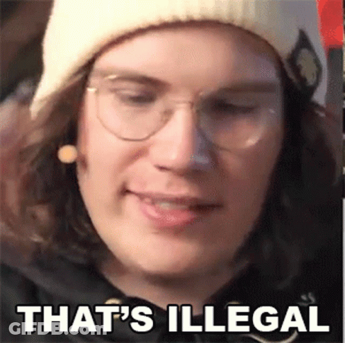 A Close Up Of A Person Wearing Glasses And A Beanie . GIF