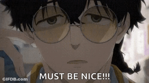 A Close Up Of A Person Wearing Glasses And A Braid . GIF
