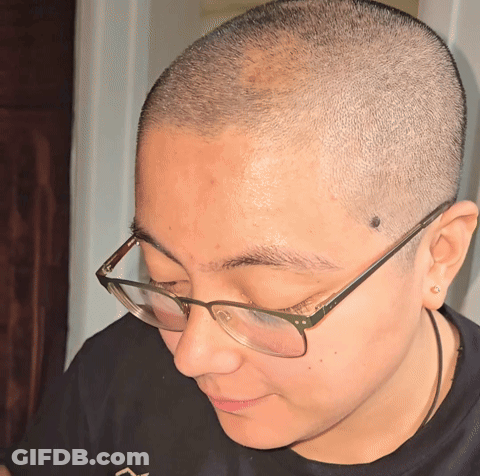 A Close Up Of A Person Wearing Glasses GIF
