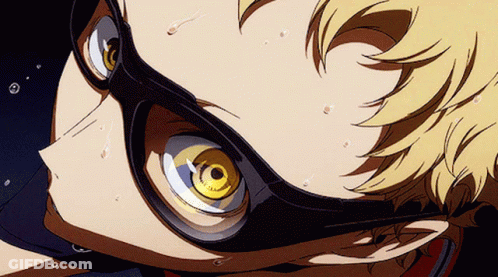 A Close Up Of A Person Wearing Glasses With A Yellow Eye GIF