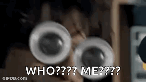 A Close Up Of A Person Wearing Googly Eyes And Asking Who Me . GIF
