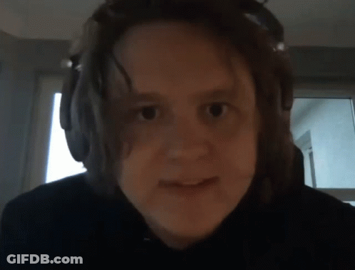 A Close Up Of A Person Wearing Headphones GIF