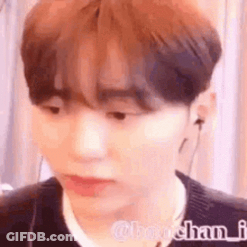 A Close Up Of A Person Wearing Headphones And A Black Sweater . GIF