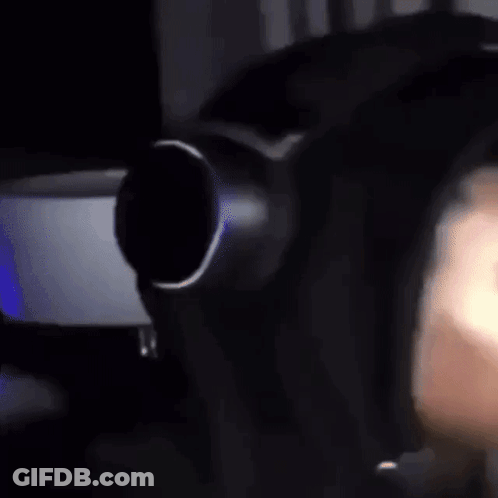 A Close Up Of A Person Wearing Headphones And A Mask . GIF