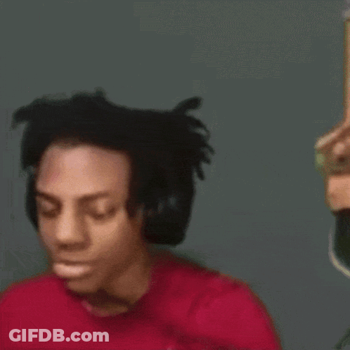 A Close Up Of A Person Wearing Headphones And A Red Shirt GIF