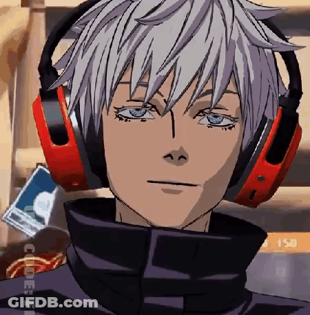 A Close Up Of A Person Wearing Headphones And Looking At The Camera . GIF