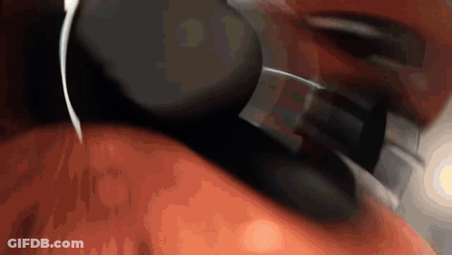 A Close Up Of A Person Wearing Headphones On Their Neck . GIF