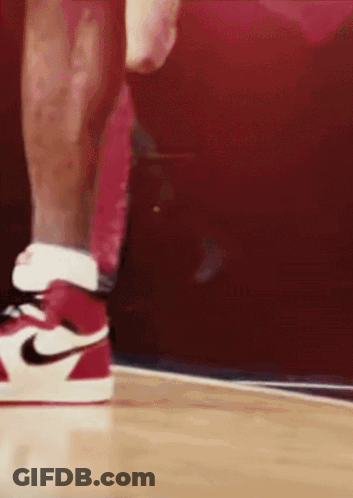 A Close Up Of A Person Wearing Red And White Nike Shoes GIF