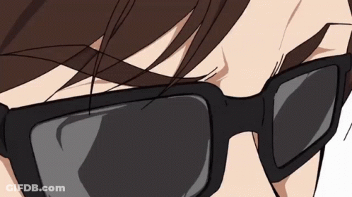 A Close Up Of A Person Wearing Sunglasses Against A White Background GIF