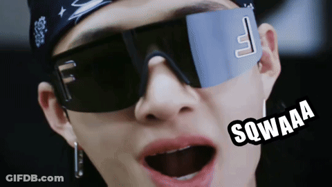 A Close Up Of A Person Wearing Sunglasses And A Bandana That Says Sqwaaa On It GIF