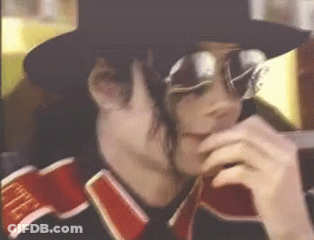 A Close Up Of A Person Wearing Sunglasses And A Hat With The Word Life On The Sleeve GIF