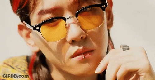 A Close Up Of A Person Wearing Yellow Sunglasses . GIF