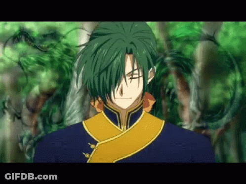 A Close Up Of A Person With Green Hair And A Blue And Yellow Outfit GIF