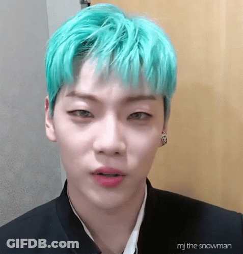 A Close Up Of A Person With Green Hair GIF