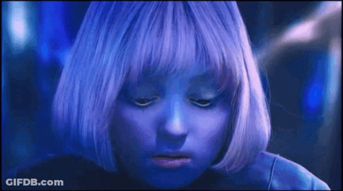 A Close Up Of A Person With Purple Hair GIF