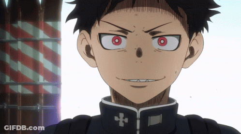 A Close Up Of A Person With Red Eyes And A Cross On Their Jacket GIF