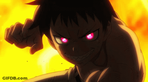 A Close Up Of A Person With Red Eyes And Teeth GIF
