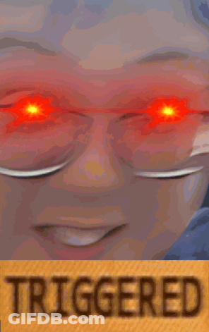 A Close Up Of A Person With Red Eyes And The Word Triggered On The Bottom GIF