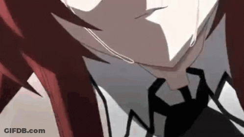 A Close Up Of A Person With Red Hair And A Black Tie . GIF