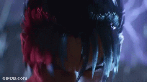 A Close Up Of A Person With Red Hair And Black Hair GIF