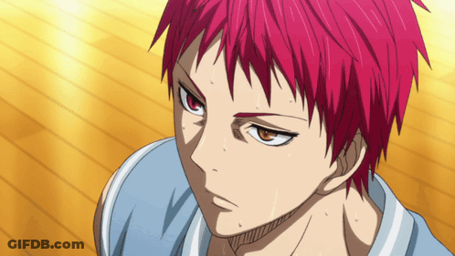 A Close Up Of A Person With Red Hair And Orange Eyes GIF