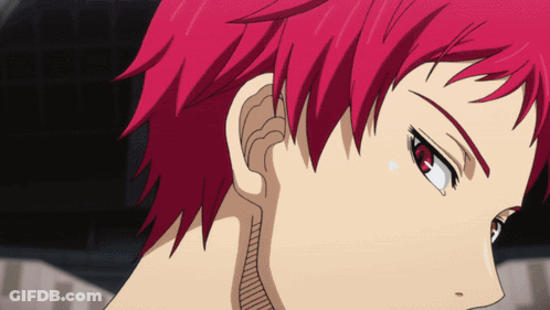 A Close Up Of A Person With Red Hair And Red Eyes GIF
