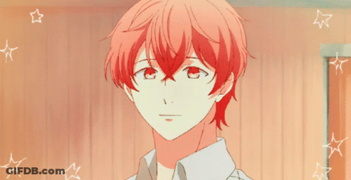 A Close Up Of A Person With Red Hair And White Stars GIF