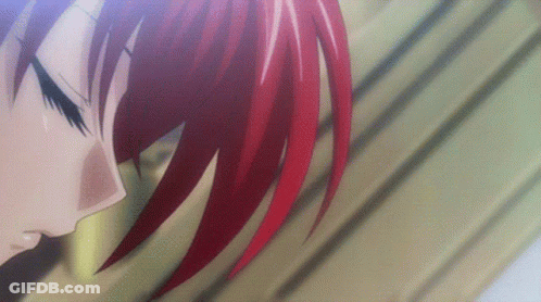 A Close Up Of A Person With Red Hair Looking Down GIF