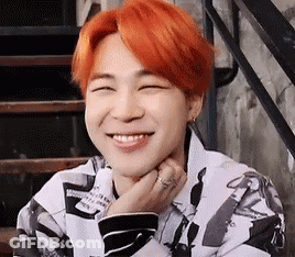 A Close Up Of A Person With Red Hair Smiling . GIF