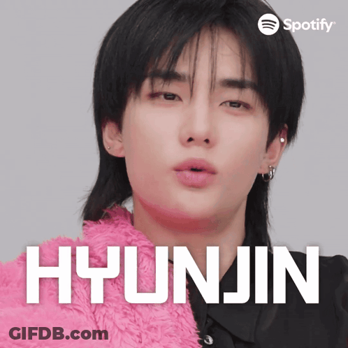 A Close Up Of A Person With The Name Hyunjin On The Bottom GIF