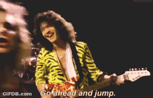 A Close Up Of A Person With The Words Go Ahead And Jump Written On The Bottom GIF