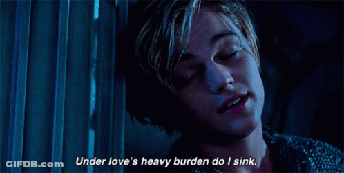 A Close Up Of A Person With The Words Under Love 'S Heavy Burden Do I Sink GIF