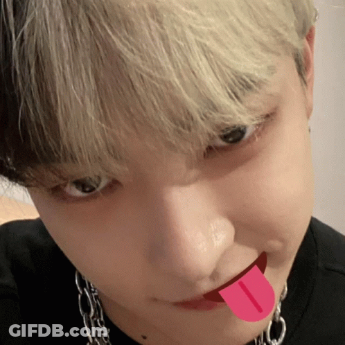 A Close Up Of A Person With Their Tongue Out GIF