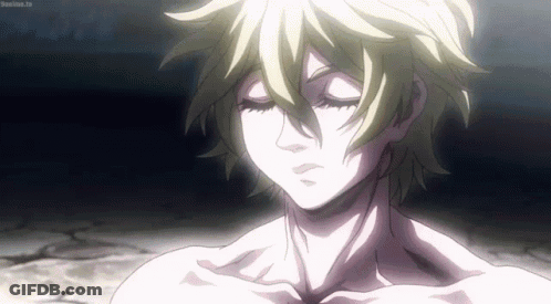 A Close Up Of A Person Without A Shirt With Their Eyes Closed In A Dark Room . GIF