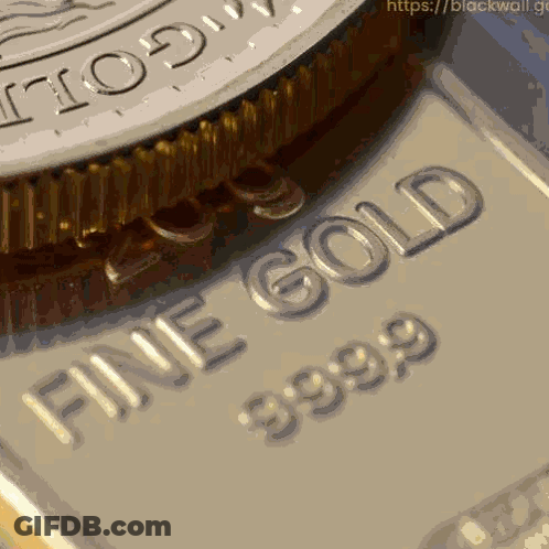 A Close Up Of A Piece Of Gold That Says Fine Gold 39.99 GIF