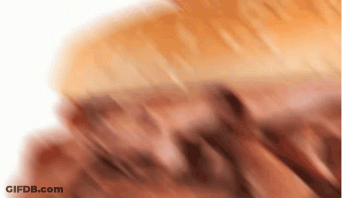 A Close Up Of A Piece Of Meat On A White Surface GIF