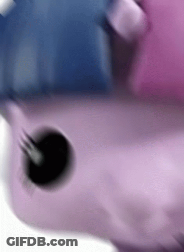 A Close Up Of A Pink And Blue Toy With A Black Hole In The Middle . GIF