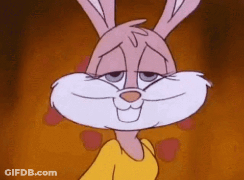 A Close Up Of A Pink Bunny Rabbit Wearing A Yellow Shirt . GIF