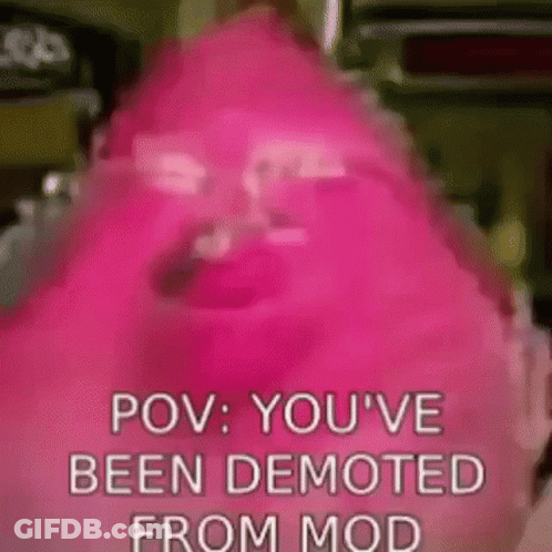 A Close Up Of A Pink Candy Bar With The Words `` Pov : You 'Ve Been Demoted From Mod '' Written On It . GIF