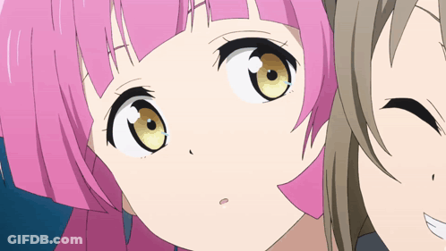 A Close Up Of A Pink Haired Anime Character GIF