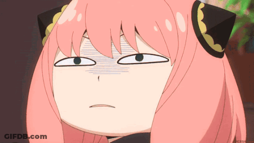 A Close Up Of A Pink Haired Anime Girl Making A Funny Face GIF