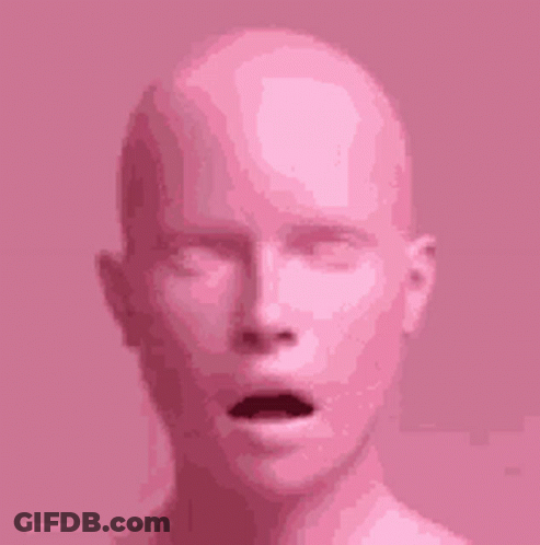 A Close Up Of A Pink Mannequin 'S Head With Its Mouth Open . GIF