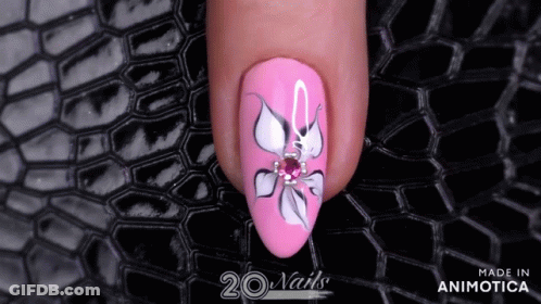 A Close Up Of A Pink Nail With A Flower Design Made In Animatica GIF