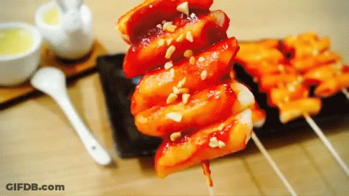 A Close Up Of A Plate Of Food With A Spoon On The Table GIF
