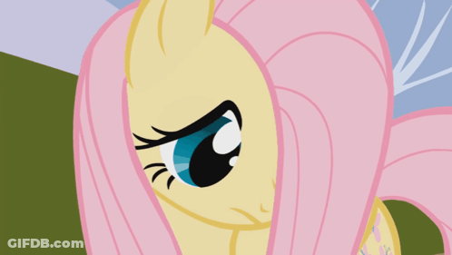 A Close Up Of A Pony 'S Face With Pink Hair GIF