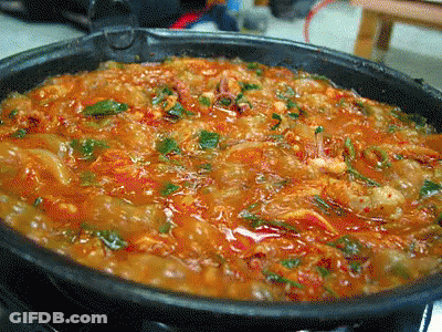 A Close Up Of A Pot Of Stew With Vegetables GIF