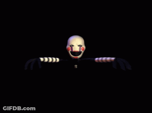 A Close Up Of A Puppet 'S Face With Purple And Red Stripes On It GIF