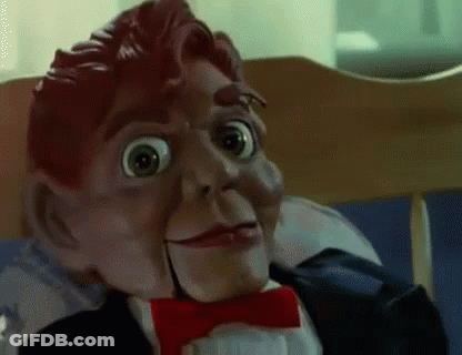 A Close Up Of A Puppet Wearing A Tuxedo And Bow Tie . GIF
