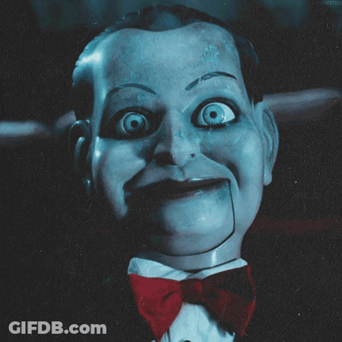 A Close Up Of A Puppet With A Red Bow Tie GIF