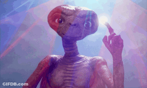 A Close Up Of A Purple Alien Holding A Light Bulb GIF